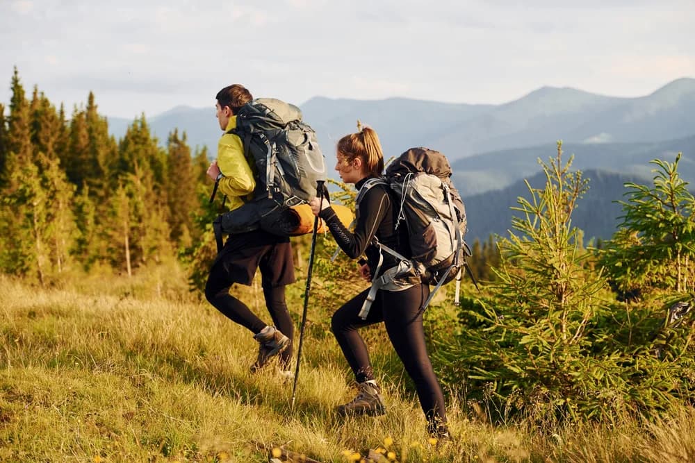 Two adults walking together on a countryside trail